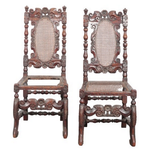 299 - A PAIR OF CHARLES II WALNUT AND CANED HIGH BACK CHAIRS

each with twin crown finials, carved through... 