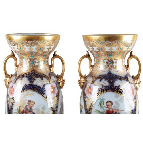 3 - A PAIR OF LARGE CONTINENTAL PORCELAIN BALUSTER VASES

19th century, with flared necks and gilt handl... 