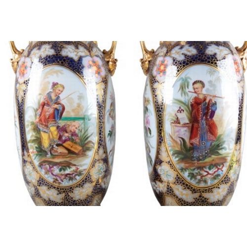 3 - A PAIR OF LARGE CONTINENTAL PORCELAIN BALUSTER VASES

19th century, with flared necks and gilt handl... 