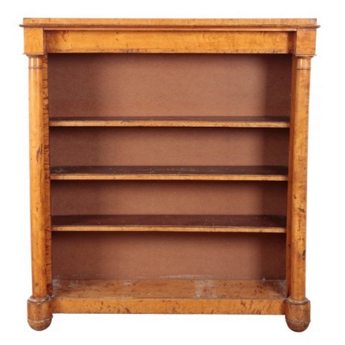 302 - A VICTORIAN SATINWOOD OPEN BOOKCASE

with three adjustable shelves flanked by turned columns, on con... 