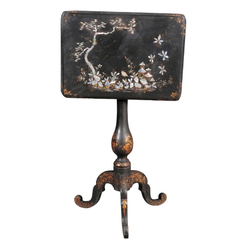 305 - A VICTORIAN PAPIER MACHE TRIPOD TABLE

the rectangular tilt top inlaid with mother of pearl and deco... 