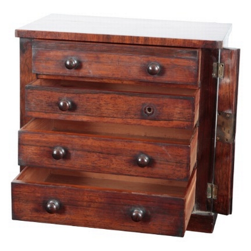 313 - AN EARLY VICTORIAN ROSEWOOD MINIATURE WELLINGTON CHEST

with four graduated cedar wood lined drawers... 