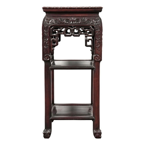 316 - A CHINESE HARDWOOD JARDINIÈRE STAND

the square top inset with marble over a foliate carved frieze a... 