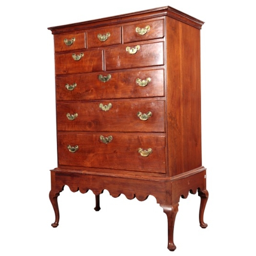 318 - A CHIPPENDALE STYLE WALNUT CHEST ON STAND

possibly American, the upper section with five short draw... 