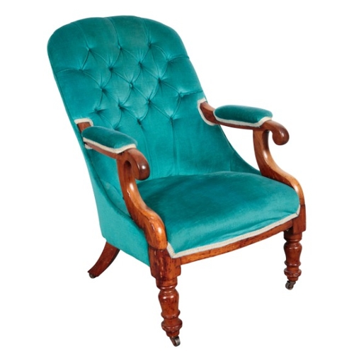 320 - A VICTORIAN WALNUT ARMCHAIR

with button back velvet covers, on turned front legs and outswept rear ... 