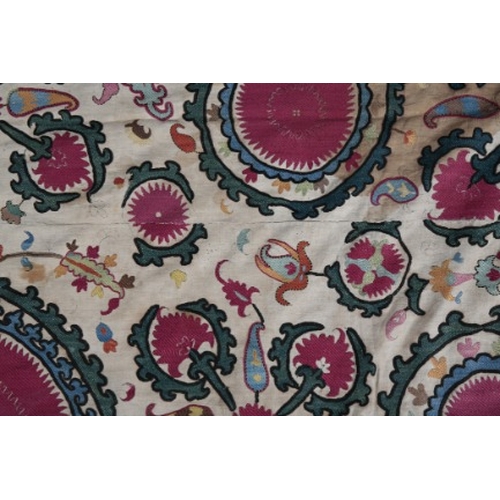 322 - AN ANTIQUE UZBEK SUZANI

19th century, the appliqué woven in colours with palmettes and leaves on a ... 