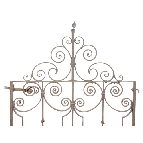 329 - A WROUGHT IRON SINGLE GARDEN GATE

19th/20th century, with a scrolling cresting, 146cm high x 102cm ... 