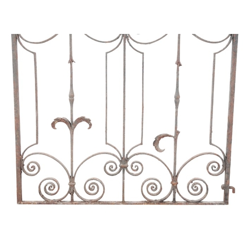 329 - A WROUGHT IRON SINGLE GARDEN GATE

19th/20th century, with a scrolling cresting, 146cm high x 102cm ... 