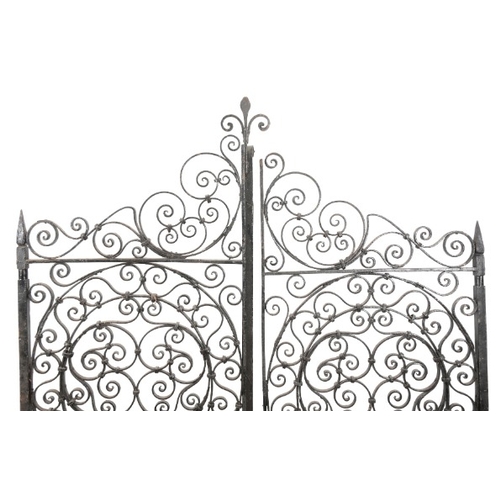 330 - A PAIR OF WROUGHT IRON GARDEN GATES

19th/20th century, profusely decorated with scrolling tendrils,... 