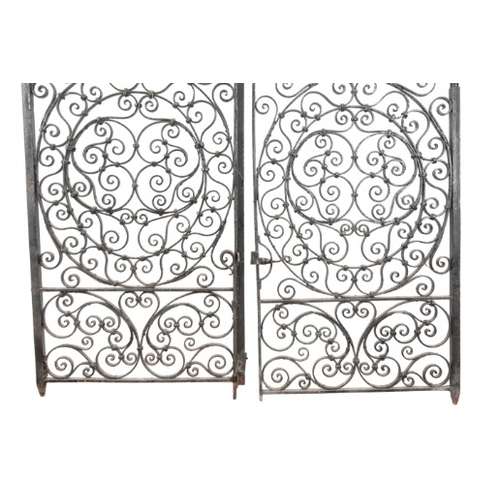 330 - A PAIR OF WROUGHT IRON GARDEN GATES

19th/20th century, profusely decorated with scrolling tendrils,... 