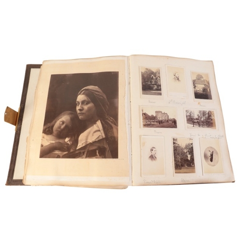 395 - DORSET INTEREST: A VICTORIAN BROWN LEATHER PHOTOGRAPH ALBUM RELATING TO MELBURY, C.1868

containing ... 