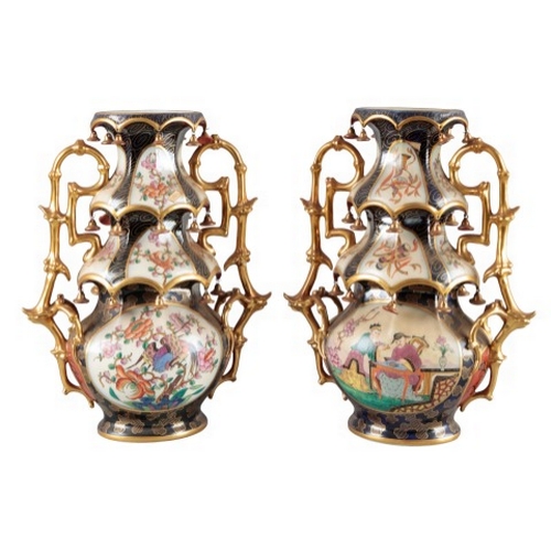 4 - A PAIR OF CONTINENTAL PORCELAIN 'PAGODA' VASES

19th century, the three tiered design with gilded ce... 