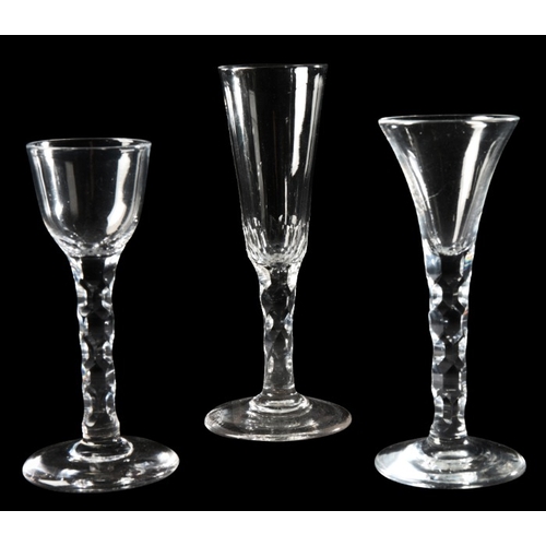 56 - A COLLECTION OF FACETED STEM GLASSES

c. 1780 and later, two with firing feet over rounded funnel bo... 