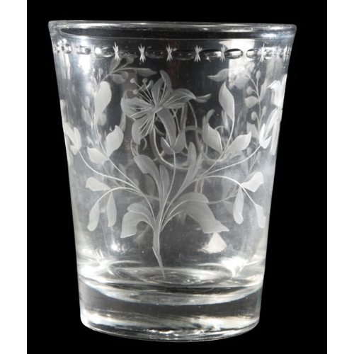 59 - AN ENGRAVED GLASS TUMBLER

18th/19th century, with decorated rim, initials to front and flowered rev... 