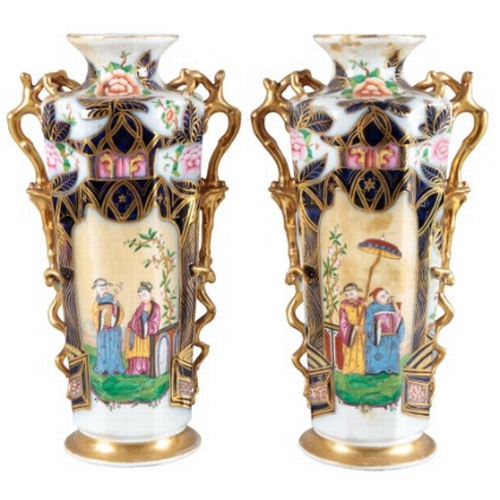 6 - A PAIR OF CONTINENTAL PORCELAIN FACETED VASES

19th century, decorated in the Imari palette with pan... 