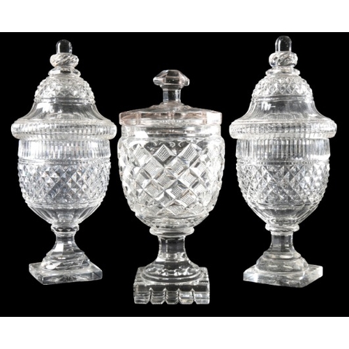 60 - A PAIR OF CUT GLASS URNS AND COVERS

19th century, of neoclassical form with turned finials, 31cm hi... 