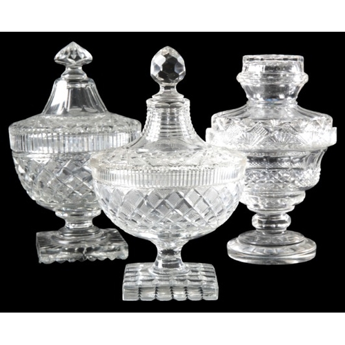 60 - A PAIR OF CUT GLASS URNS AND COVERS

19th century, of neoclassical form with turned finials, 31cm hi... 