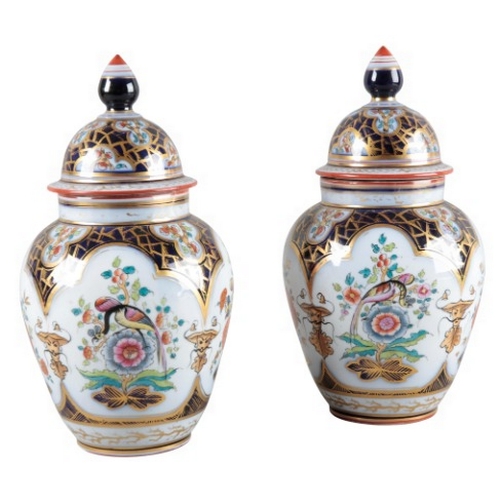 7 - A PAIR OF CONTINENTAL PORCELAIN SLEEVE VASES

19th century, decorated in the Chinoiserie taste with ... 