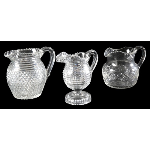 65 - A COLLECTION OF SIX GLASS JUGS

19th and 20th century, including a jug engraved with leaves, 19cm hi... 