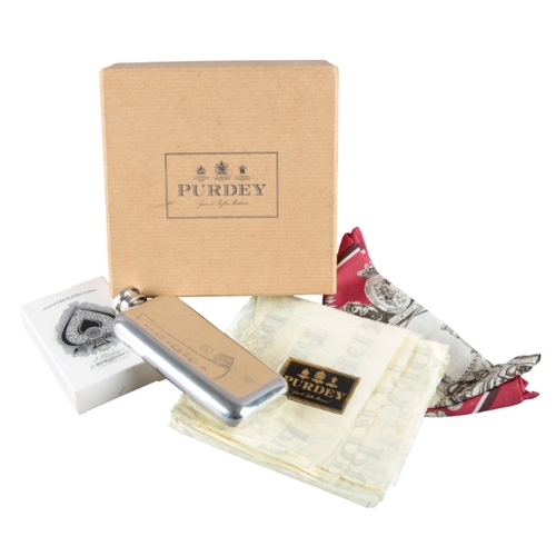 238 - PURDEY GUN MAKERS: A GENTLEMAN'S ACCESSORY SET

including a hip flask, measuring 12cm x 5.5cm, Purde... 