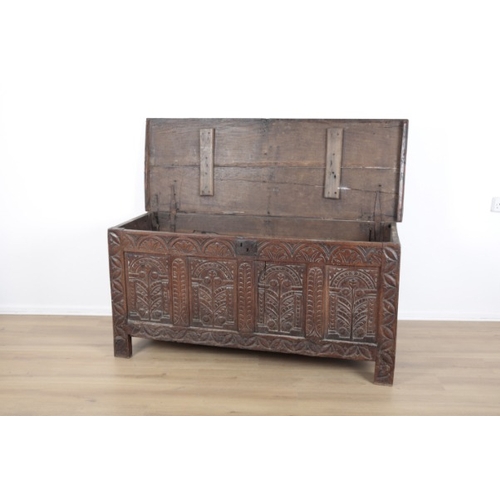 13 - A CARVED OAK CHEST

18th century, the two plank top with pie-crust edge, the front carved with arcad... 