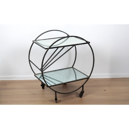 187 - AN ART DECO STYLE DRINKS CART

mid-century modern, the black metal circular outline with sunray deta... 