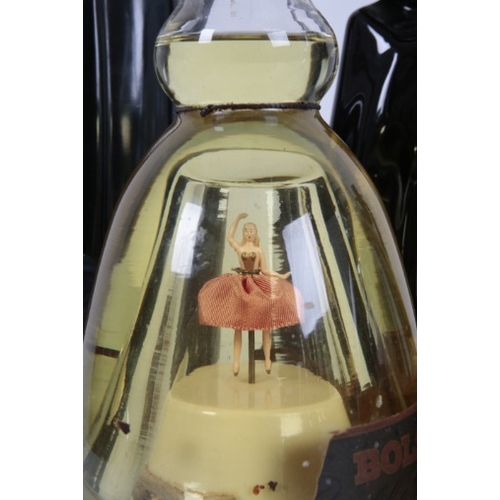 188 - THREE BOLS 'BALLERINA' MUSICAL DECANTERS

with unopened contents, two with red skirts, one with a wh... 