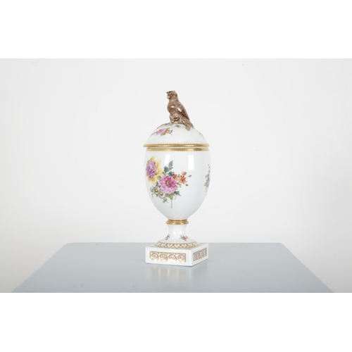 192 - A ROYAL COPENHAGEN PORCELAIN LIDDED URN

with owl finial (chipped), decorated with a profusion of fl... 