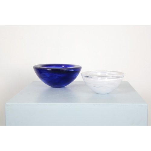 198 - TWO KOSTA BODA CIRCULAR GLASS BOWLS

one clear with swirling milky inclusions, 17.5cm diameter, the ... 