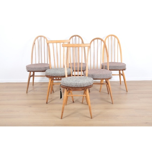 202 - ERCOL, MODEL 365: FOUR BEECH AND ELM 'WINDSOR DINING CHAIRS

mid-century modern; together with anoth... 