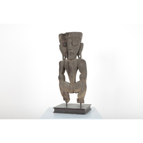 205 - AN AFRICAN CARVED TRIBAL STANDING FIGURE

with pendulous pierced ear lobes, mounted on wooden plinth... 