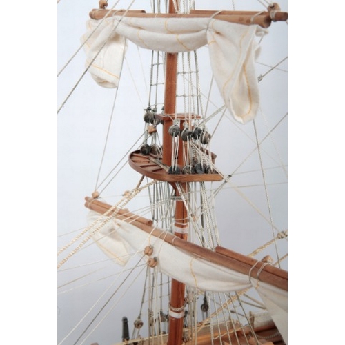 21 - 'HMS VICTORY': A LARGE WOODEN SCALE MODEL OF THE NAVAL WARSHIP

on a wooden stand with plaque, 