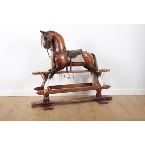 210 - STEVENSON BROTHERS OF BETHERSDEN, NO. 3354: AN OAK ROCKING BAY HORSE

with brushed bronze plaque for... 