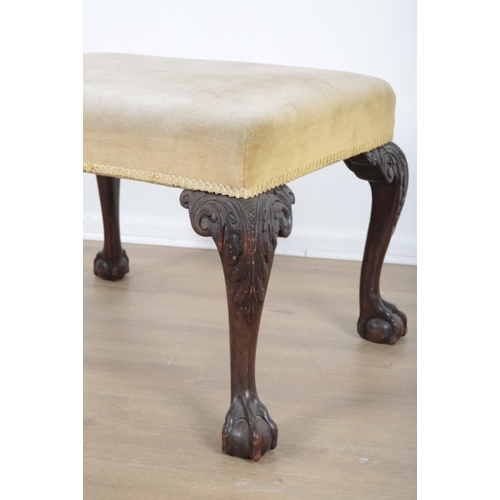 27 - AN EARLY GEORGIAN STYLE MAHOGANY RECTANGULAR STOOL

1920s, upholstered in yellow velvet, on acanthus... 