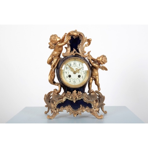 41 - A FRENCH GILT METAL MOUNTED BLUE PORCELAIN CLOCK GARNITURE

in the Rococo style, the clock surmounte... 