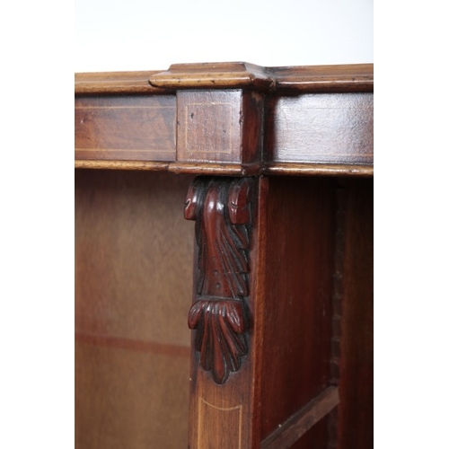 433 - A VICTORIAN BREAKFRONT MAHOGANY BOOKCASE

with satinwood stringing and acanthus corbel detailing, te... 