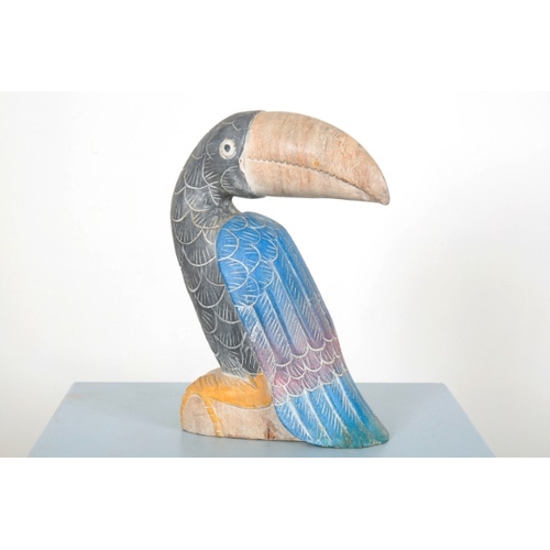 50 - A CARVED AND POLYCHROME PAINTED WOODEN TOUCAN

stylised, facing to the right, 36cm high