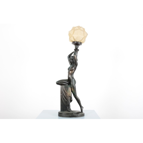 51 - AN ART DECO PLASTER OR CHALKWARE FIGURAL LAMP

the naked lady resting on plinth with drapery, holdin... 