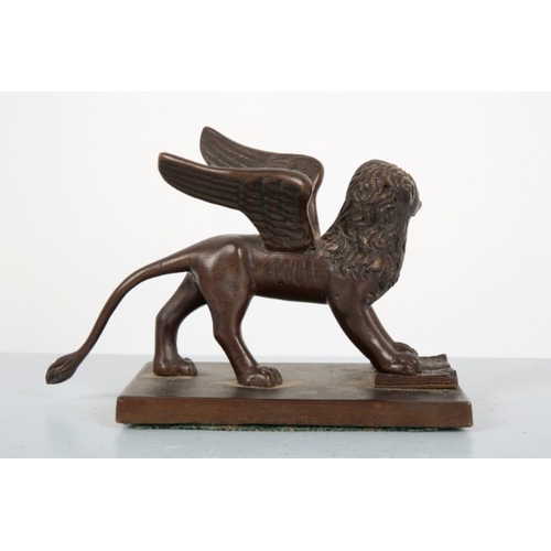 54 - A BRONZE FIGURE OF THE WINGED LION OF VENICE

20th century, standing on a plinth, the front legs res... 