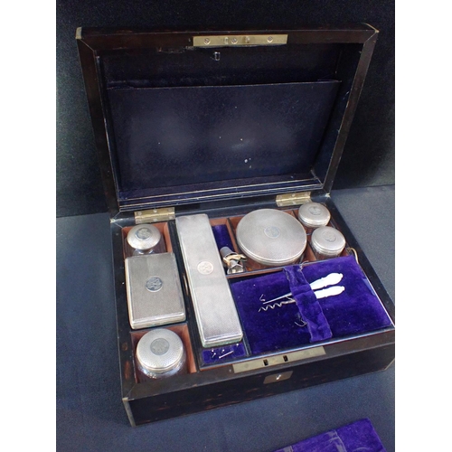 145 - A VICTORIAN COROMANDEL DRESSING BOX

dated Oct 1874, the fitted interior with silver-plated topped j... 