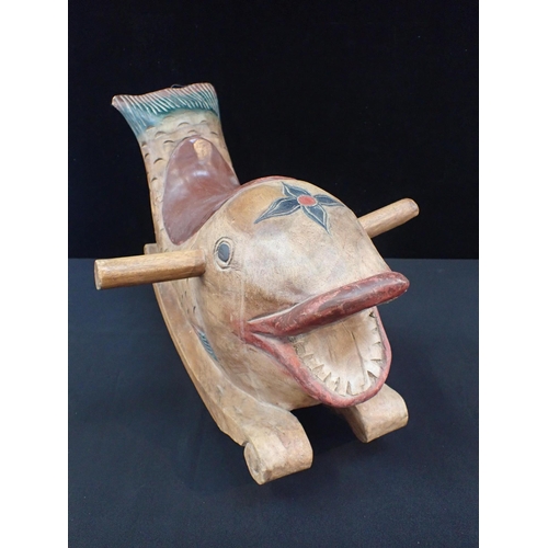 160 - A CARVED INDIAN HARDWOOD ROCKING TOY FISH

with painted decoration 56cm long