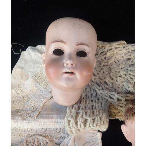 180 - MORIMURA BROTHERS, JAPAN; A BISQUE HEADED DOLL

marked 'MB, 2, Japan' with composition body (for res... 