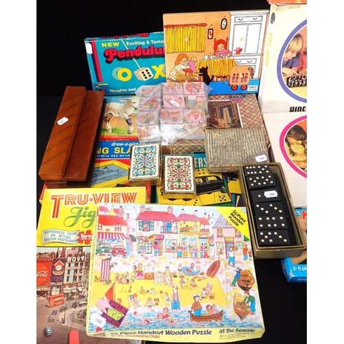 185 - A COLLECTION OF GAMES

including jig-saws, cards, dominoes, children's games etc.