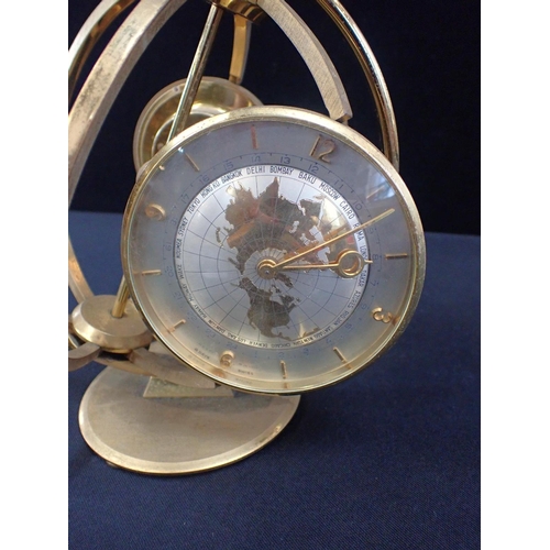 188 - A MID-CENTURY IMEXAL CLOCK/BAROMETER/THERMOMETER

with alarm, in a spherical  rotating brass frame, ... 