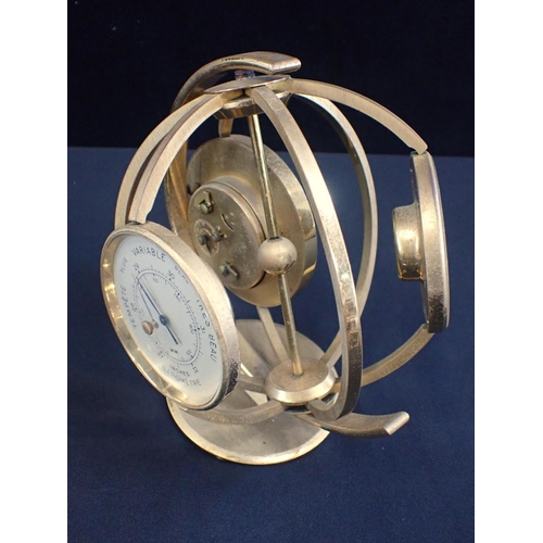 188 - A MID-CENTURY IMEXAL CLOCK/BAROMETER/THERMOMETER

with alarm, in a spherical  rotating brass frame, ... 