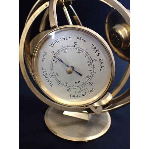 188 - A MID-CENTURY IMEXAL CLOCK/BAROMETER/THERMOMETER

with alarm, in a spherical  rotating brass frame, ... 