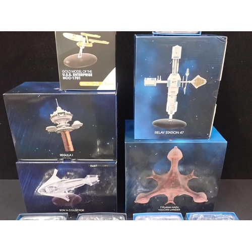 214 - FOUR BOXED EAGLEMOSS HERO COLLECTOR 'STAR TREK' SPACE SHIP MODELS

With a Gold model of the U.S.S. E... 