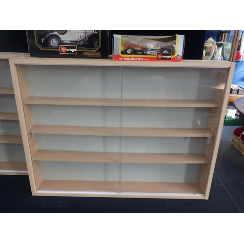 49 - TWO DISPLAY CASES

with sliding glass door fronts and four shelves, 80cm wide, 60cm high, 10cm deep,... 