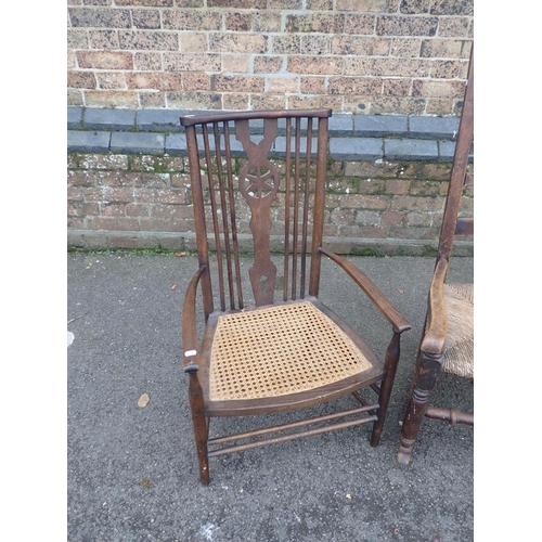 637 - AN 18th CENTURY COUNTRY ROCKING CHAIR

(missing one back spindle) and a later wheel back armchair