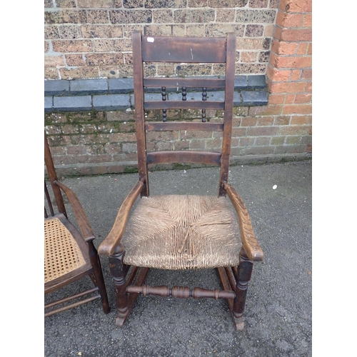 637 - AN 18th CENTURY COUNTRY ROCKING CHAIR

(missing one back spindle) and a later wheel back armchair